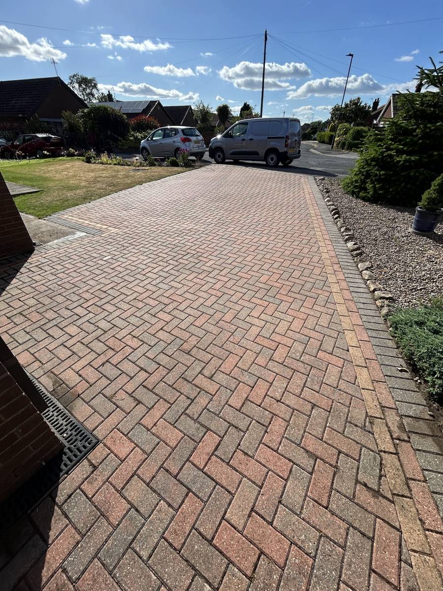 A block paved driveway after jet washing